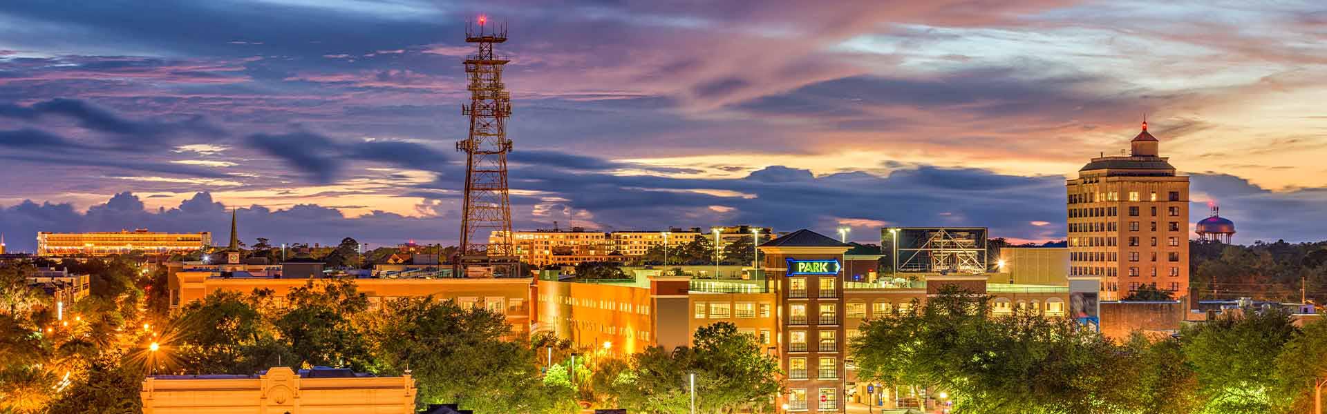 Neon color image of a band playing and people singing along
